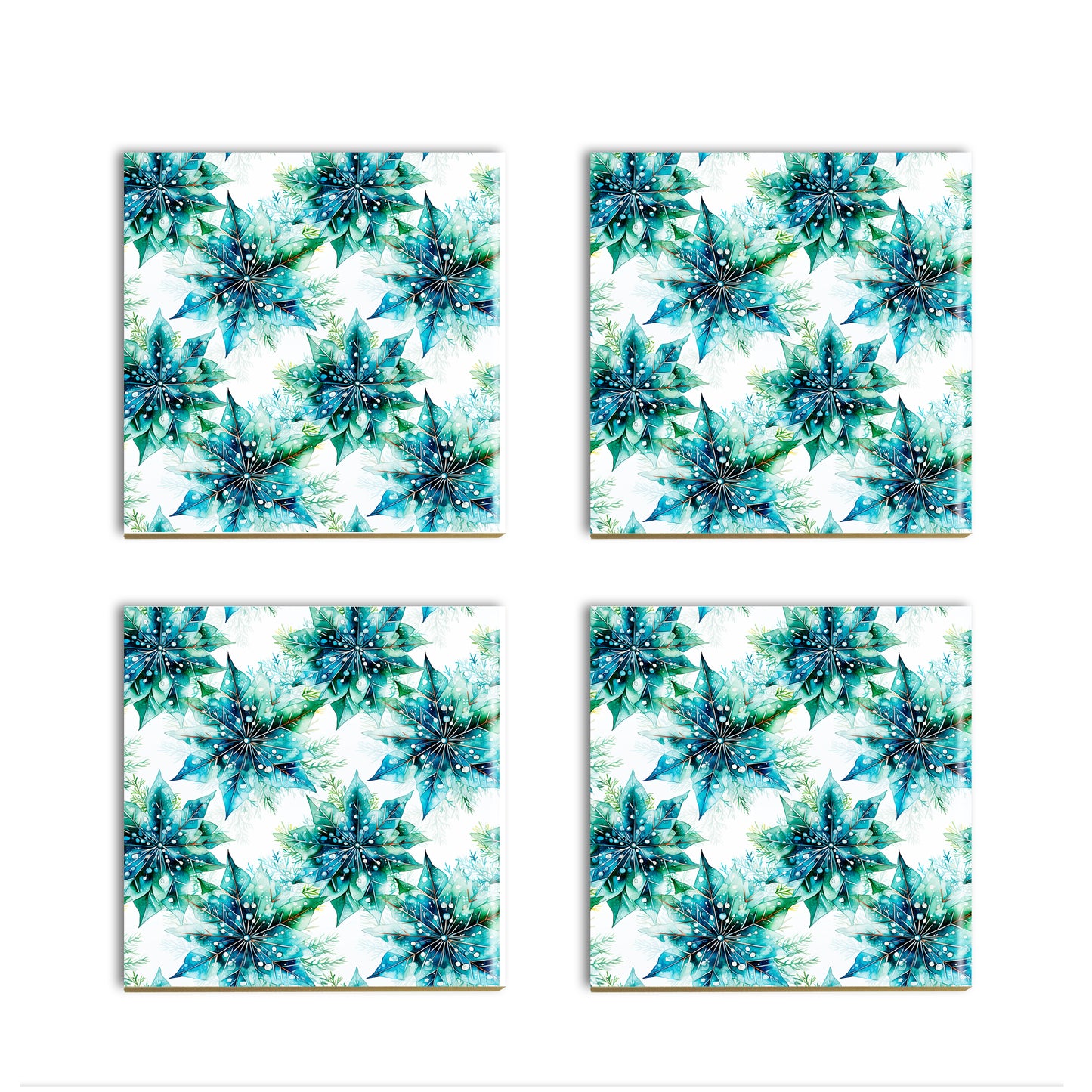 a set of four coasters with blue flowers on them