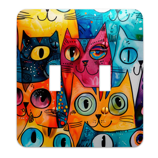 a light switch cover with cats painted on it
