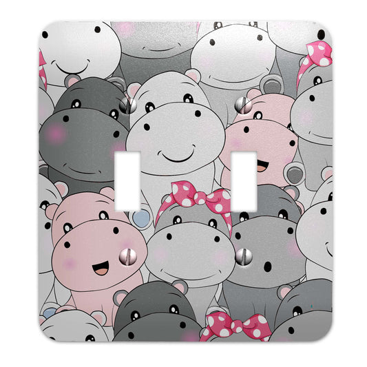 a light switch cover with a bunch of hippos