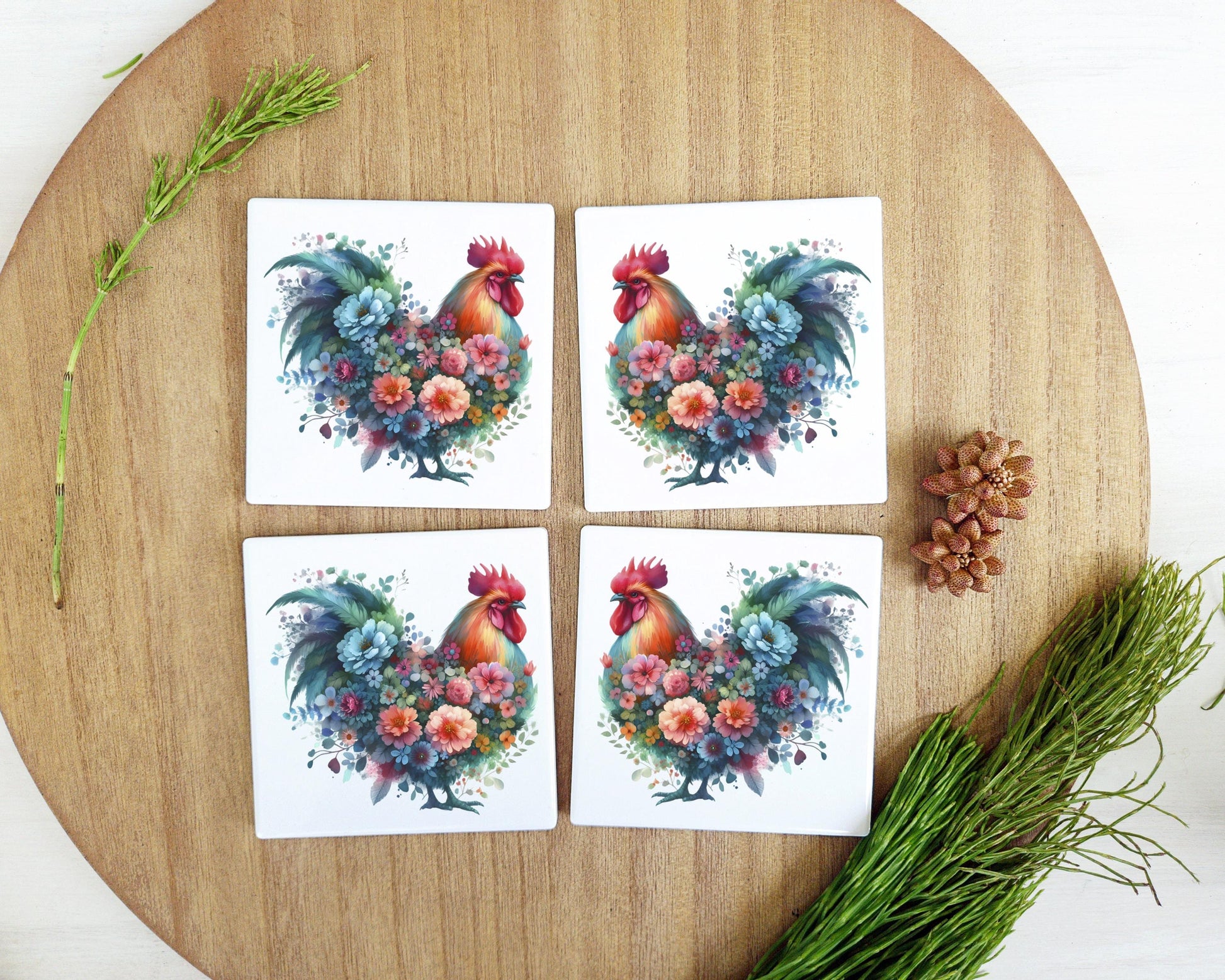 four coasters with a rooster and flowers on them